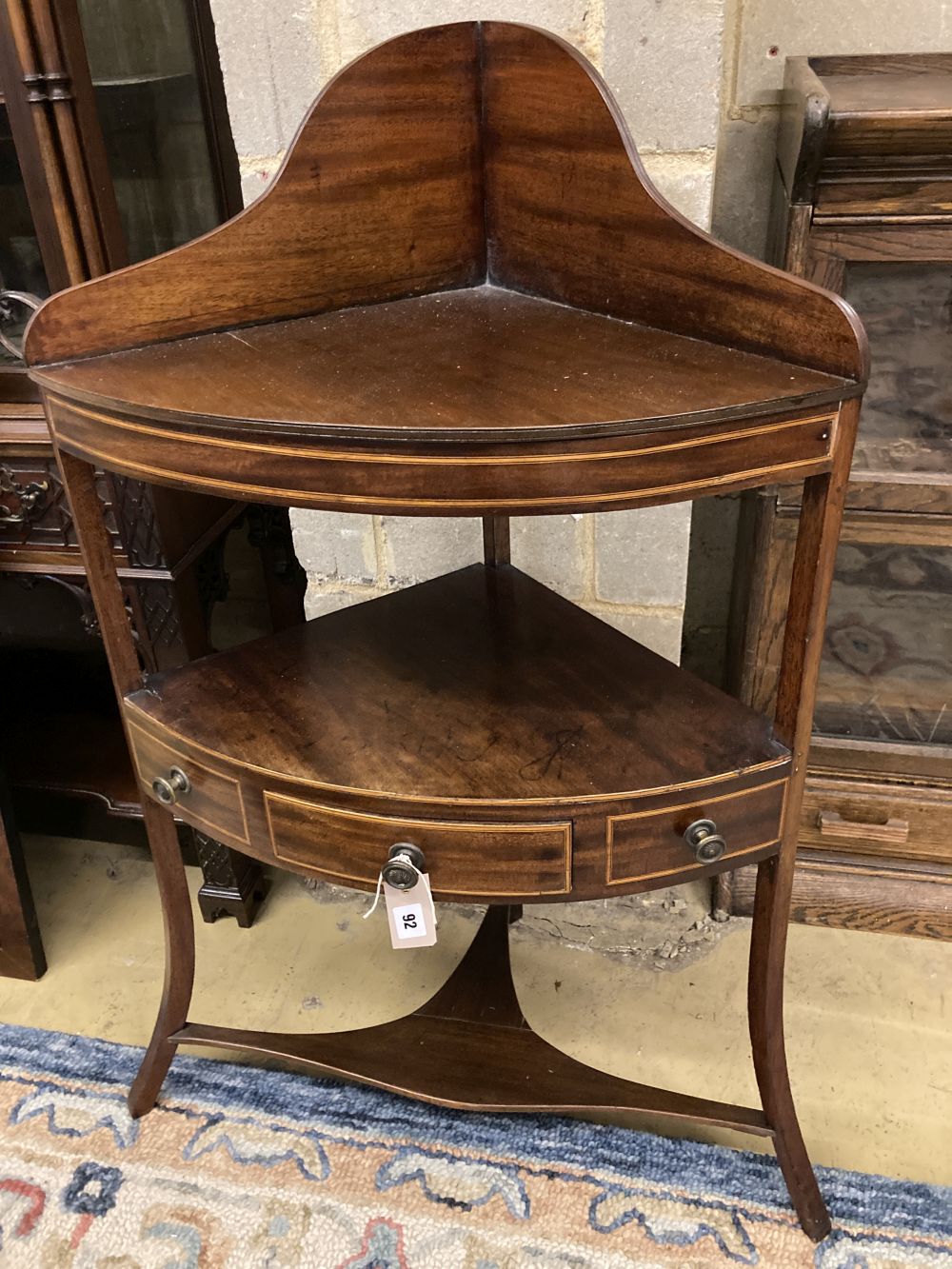 A George III mahogany corner washstand, width 60cm, depth 38cm, height 100cm